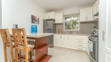 Family Villa, 3 Bedrooms, Patio, Garden View | Private kitchen | High chair