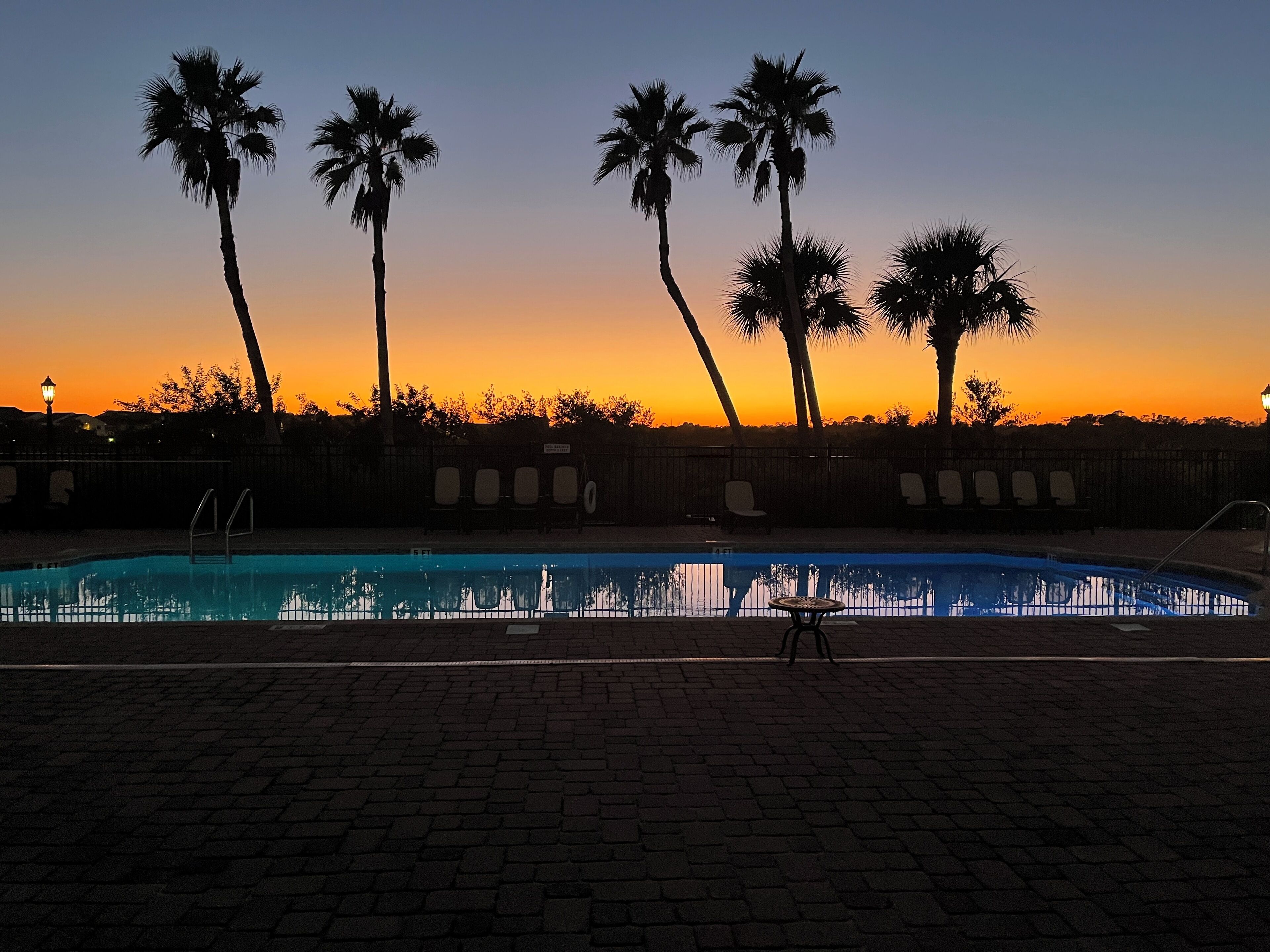 Sunsets over the pool and hot tub area create stunning evening views