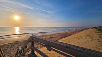 On the beach, sun loungers, beach towels