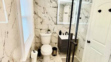 Shower, hair dryer, towels, soap