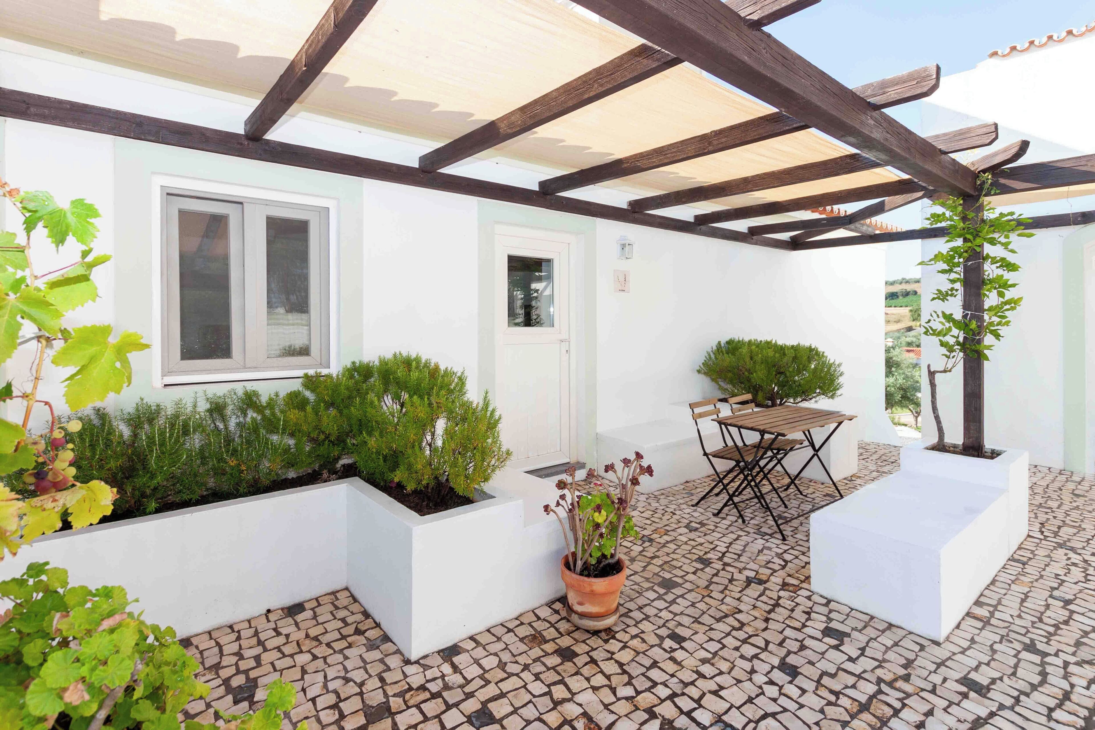 Familie cottage, 2 slaapkamers, kitchenette, uitzicht op tuin | Terras