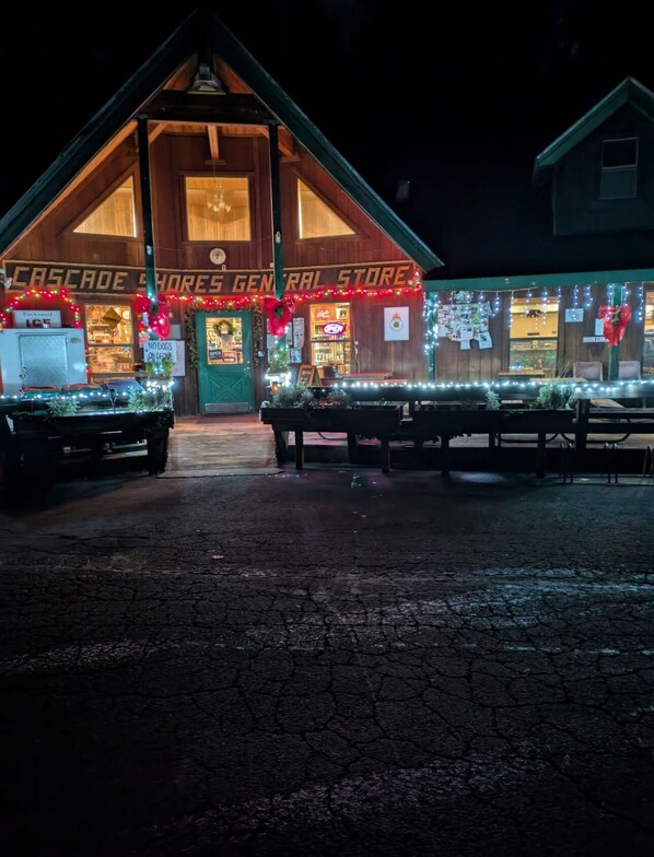 A building with a sign reading "Cascade Shores General Store" and a wooden facade.
