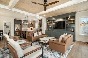 TV, books - Villa Azul: Upscale Home with Pool, Elevator (Oak Island)