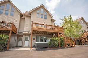 A two-story building with a deck and a hot tub. - New! Lake Access Home in Deep Creek w/ Hot Tub (Oakland)