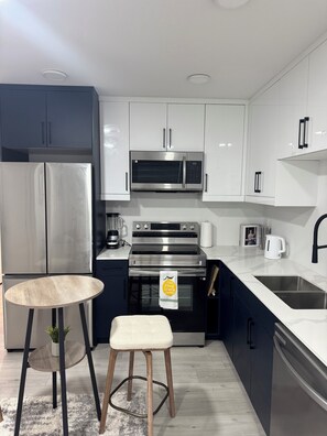 Microwave, oven, stovetop, dishwasher - Modern 2-Bedroom Lower Suite Near Pembina | Bright, Spacious & Private (Winnipeg)