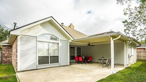 A single-story house with a covered patio area, a brick exterior, and a large window. - Newly updated• 3BR/2BA • 7 Beds • Pets Welcome (Youngsville)