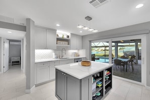 Fridge, microwave, oven, stovetop - Escape to Paradise | Stunning Gulf-Access Waterfront Home with Heated Pool, Spa & Boat Dock (Cape Coral)