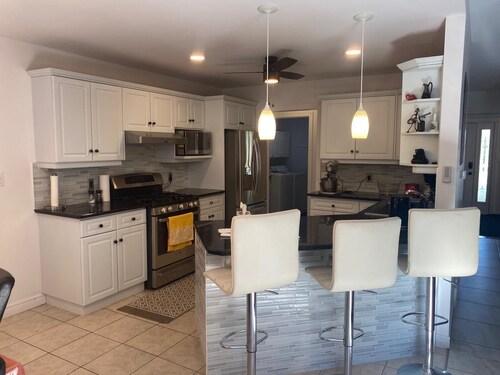 Luxury Home Near 402 • Whirlpool Suite, Fireplace, Full Kitchen & EV Charger