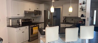 Luxury Home Near 402 • Whirlpool Suite, Fireplace, Full Kitchen & EV Charger