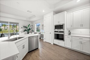 Microwave, oven, stovetop, dishwasher - Charming lakeside home with pool, spa  and modern coastal design. (Ave Maria)
