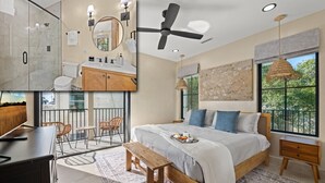 A modern bedroom with a large bed, a balcony with outdoor seating, a shower area, and a view of greenery. - Gulf views, Saltwater lagoon & waterfall, Beach@2min walk, Firepit, Golf Cart, Elevator (Destin)