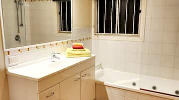 Shower, hair dryer, towels, toilet paper