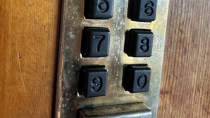 A close-up of a keypad with numbers 0-9 and a central button. - Bobbi's on the Hill (Waynesville)