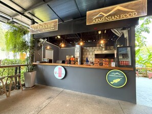 A restaurant named "Vlavashe" with a sign indicating it serves Armenian food.