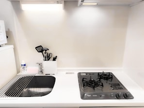 Fridge, microwave, stovetop, cookware/dishes/utensils