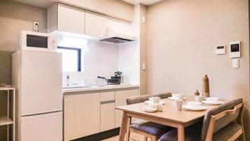 Fridge, microwave, electric kettle, cookware/dishes/utensils