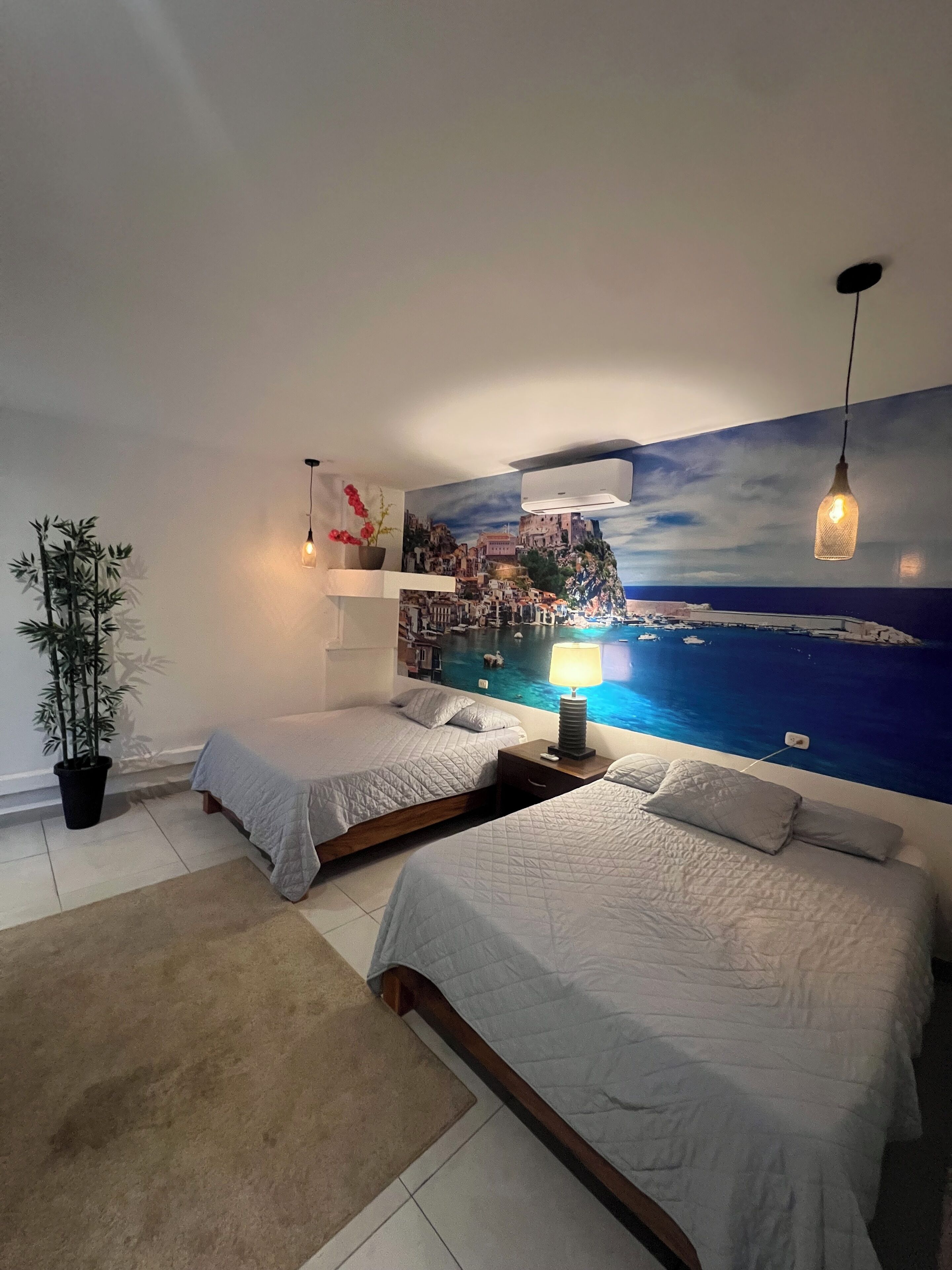 Deluxe Quadruple Room, Balcony, Pool View | In-room safe, blackout drapes, iron/ironing board, free WiFi