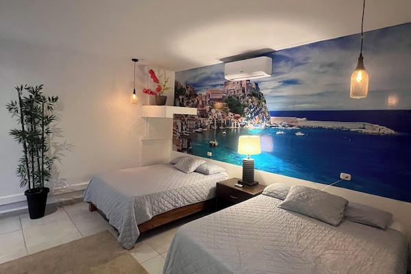 Deluxe Quadruple Room, Balcony, Pool View | Peti besi dalam bilik, langsir/tirai gelap terus