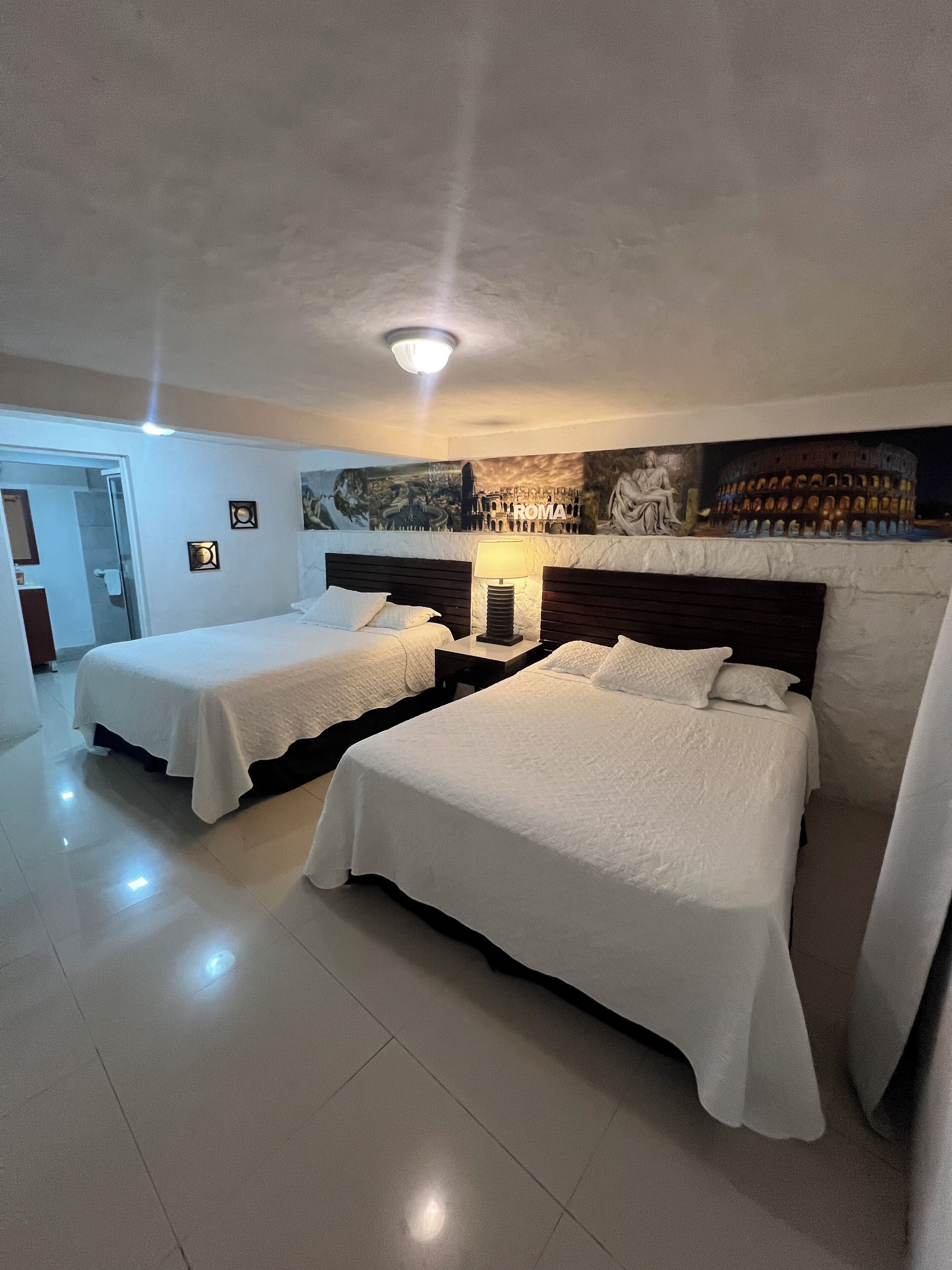 Deluxe Quadruple Room, Balcony, Garden View | In-room safe, blackout drapes, iron/ironing board, free WiFi