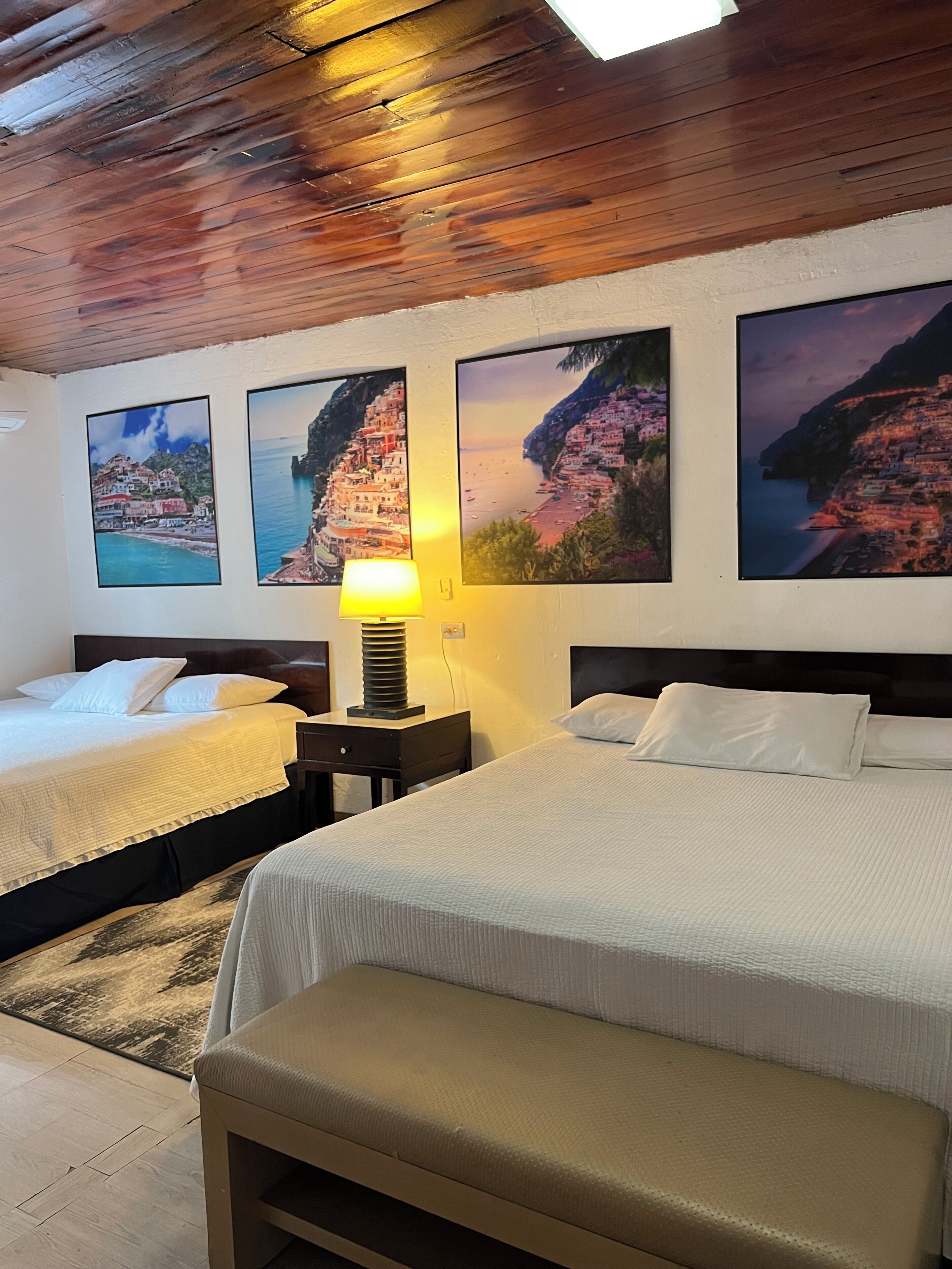 Deluxe Quadruple Room, Balcony | In-room safe, blackout drapes, iron/ironing board, free WiFi