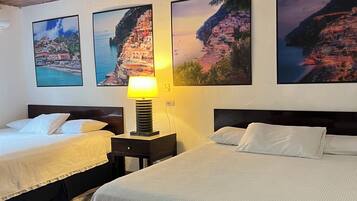 Deluxe Quadruple Room, Balcony - Positano | In-room safe, blackout drapes, iron/ironing board, free WiFi