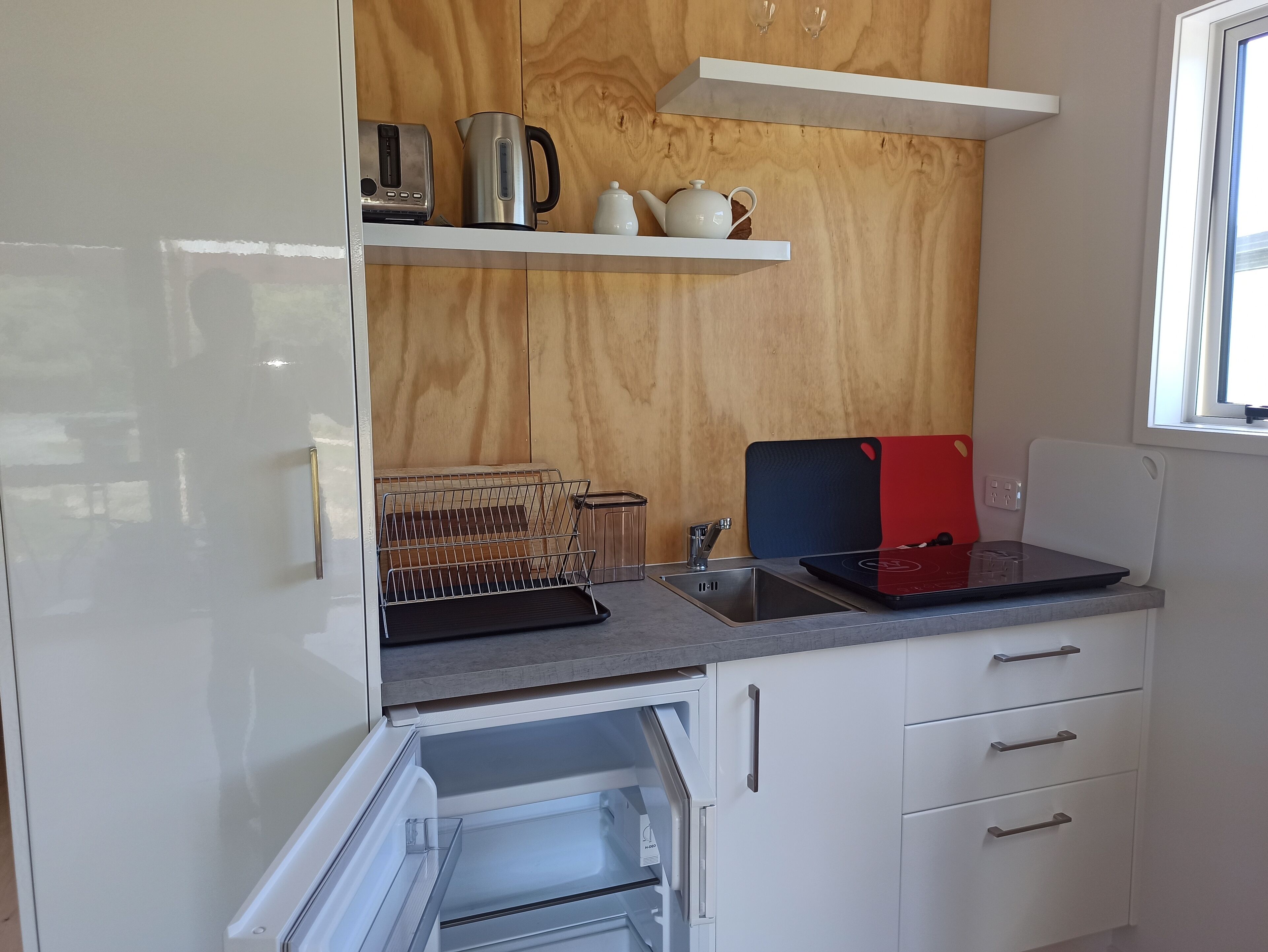 Fridge, stovetop, coffee/tea maker, cookware/dishes/utensils