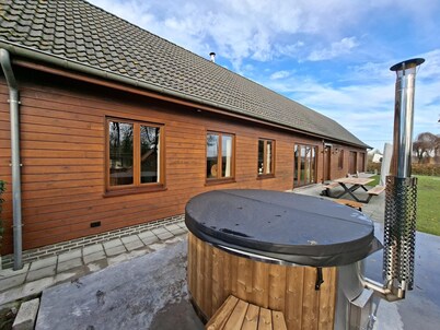 Luxury wooden house with spa bath and garden