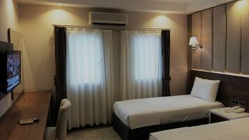 Standard Triple Room, Garden View | In-room safe, blackout drapes, iron/ironing board, free WiFi