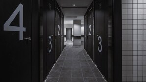 A hallway with doors numbered 3, 4, and 5.
