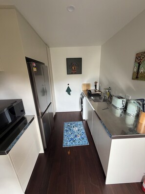 Fridge, microwave, electric kettle, toaster - Paradise Found at Studio 65. Modern, quiet, studio apartment with lake views (Hamurana)