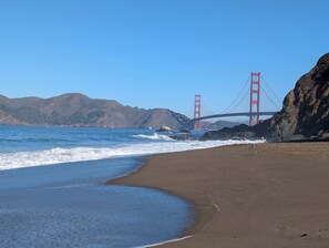 A beach with a view of the Golden Gate Bridge and hills in the background. - Bright and Spacious Family Home in the South San Jose Bay Area (San Jose)