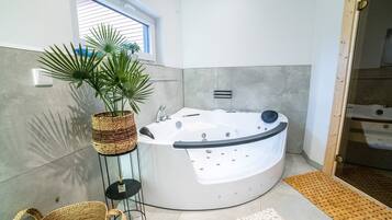 Jetted tub, hair dryer, towels, soap