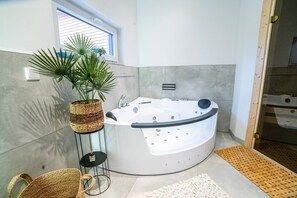 Jetted bath, hair dryer, towels, soap