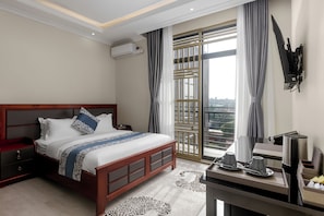 In-room safe, desk, laptop workspace, blackout drapes - BEAL MALL AND HOTEL (Arua)