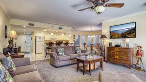A spacious living room with a sofa, coffee table, and a ceiling fan. - Golf Course Views • Fireplace • Free DOLLYwood Ticket • Near Dollywood (Pigeon Forge)