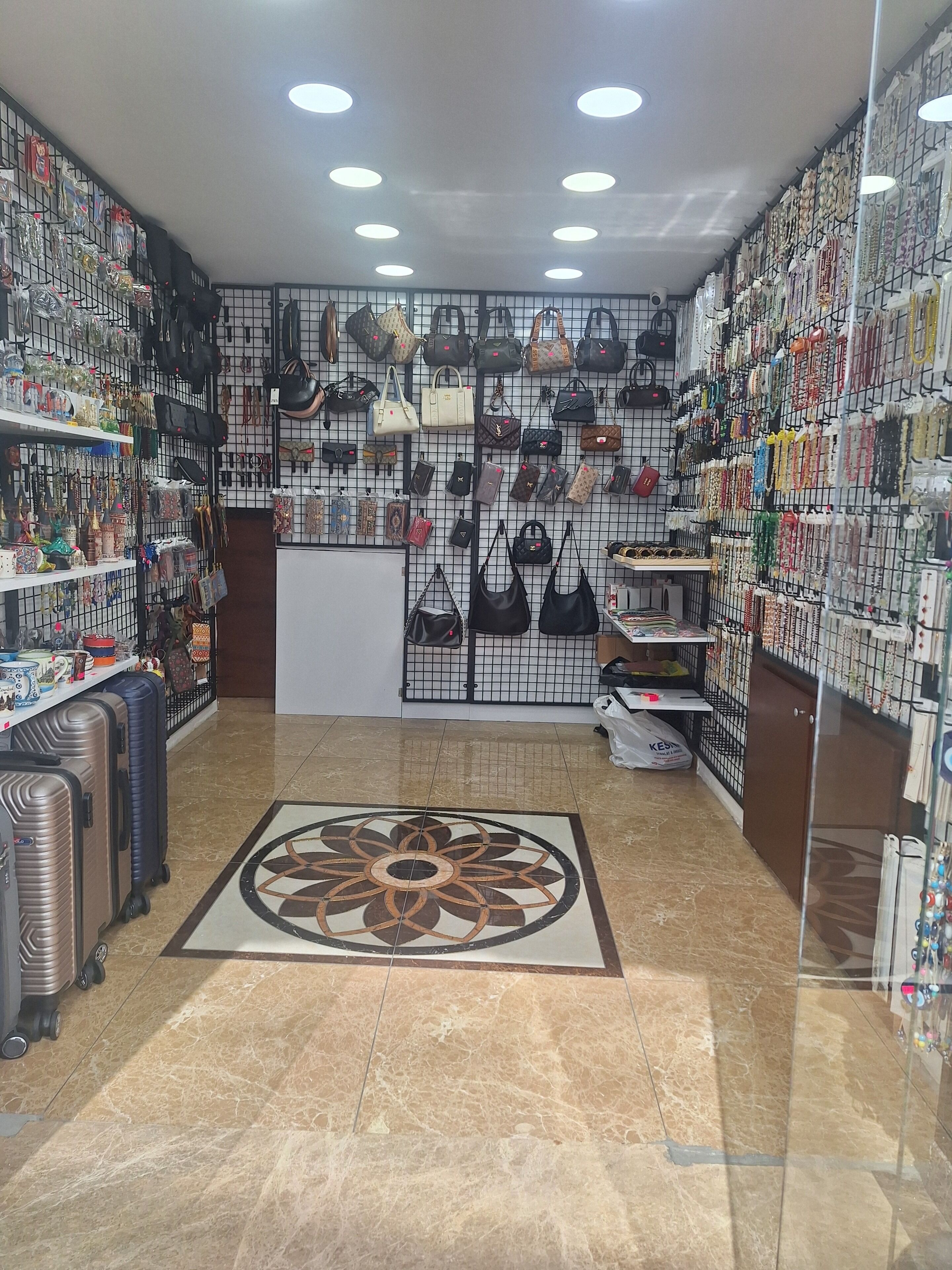A jewelry store with handbags and accessories on display.