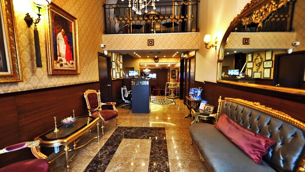 A luxurious lobby with a grand chandelier, ornate furniture, and a high ceiling. - ELYSİON HOTEL (İstanbul)