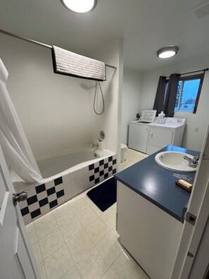 Shower, towels, soap, toilet paper