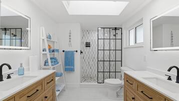 Shower, hair dryer, towels, soap