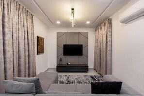 Superior suite, balkon, uitzicht op stad | Woonruimte