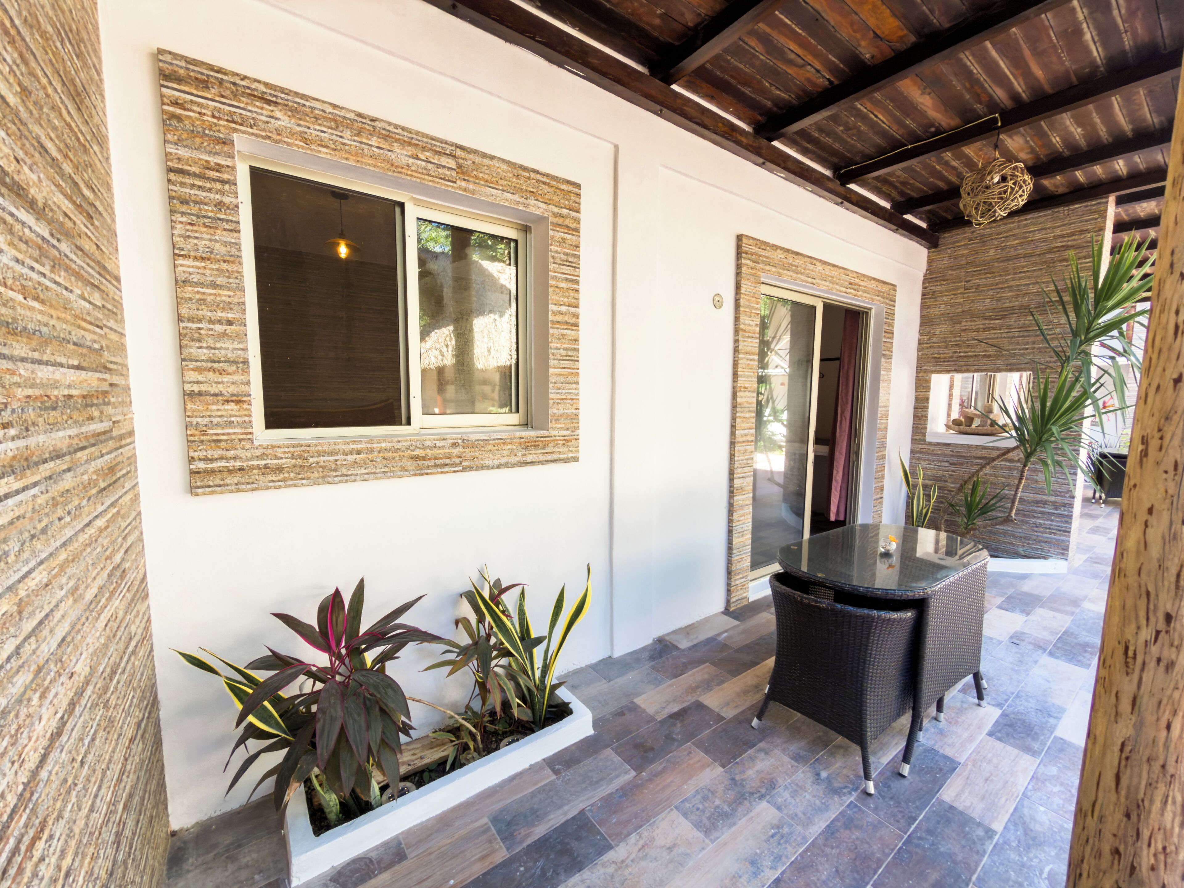 Habitación cuádruple Deluxe, vista al jardín | Vista del balcón