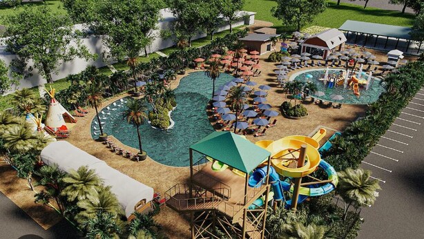 An aerial view of a resort with a large pool, play area, and outdoor seating. - Luxury rv lot 191 at River ranch rv resort golf cart included  NO RV INCLUDED (Lake Wales)
