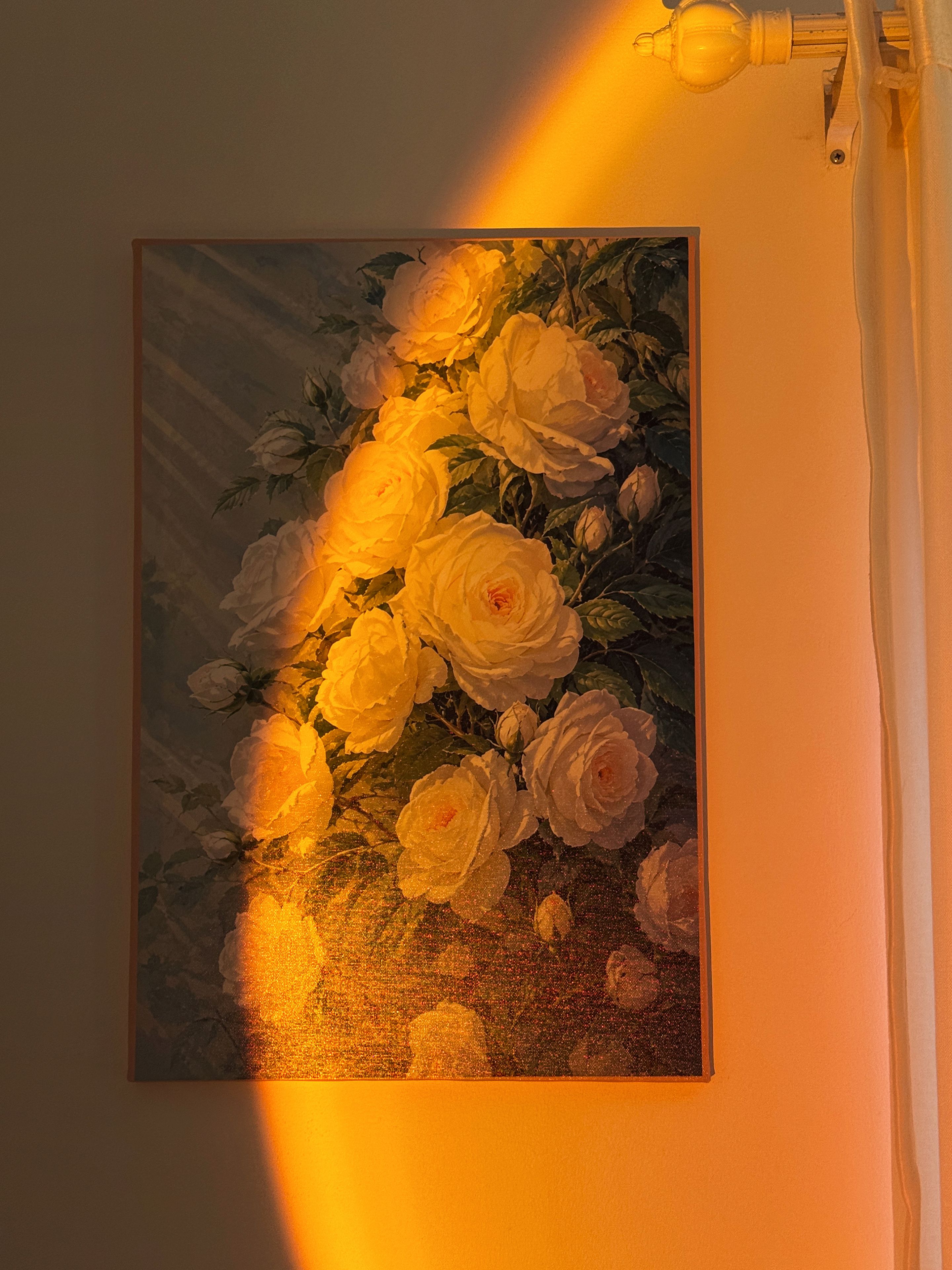 A painting of white roses on a wall.