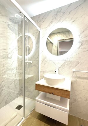 Shower, hair dryer, towels, soap