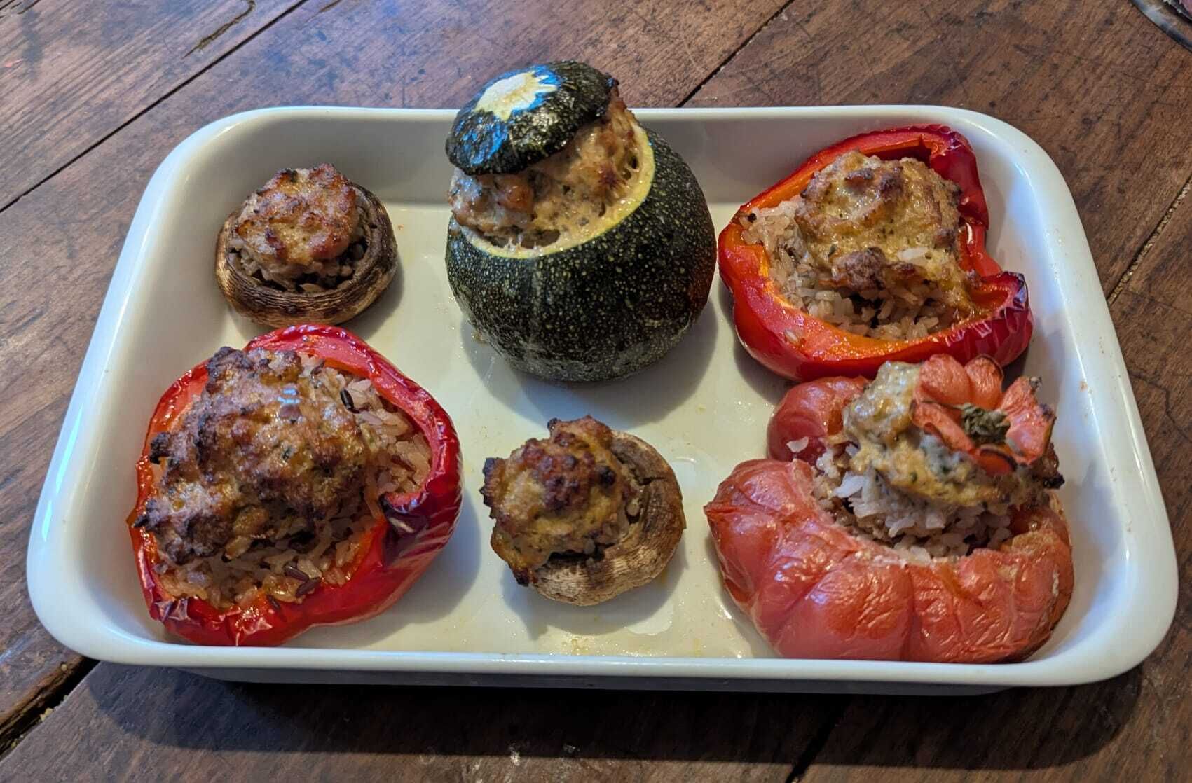 A white rectangular dish containing stuffed vegetables.