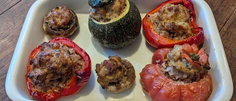 A white rectangular dish containing stuffed vegetables.