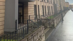 A multi-story building with a modern architectural style, featuring a series of balconies and large windows. - Maison 109 Suite (Glasgow)