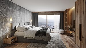 A modern bedroom with a large bed, a view of the mountains, and wooden furniture. - Superior Vacation Apartment Near Glacier (Fulpmes)