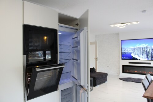 Central apartment with XXL TV/Wlan, fully equipped kitchen & fireplace