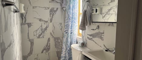 Hair dryer, towels, soap, toilet paper